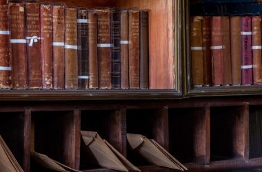 Antique desk with books and letters in pigeonholes