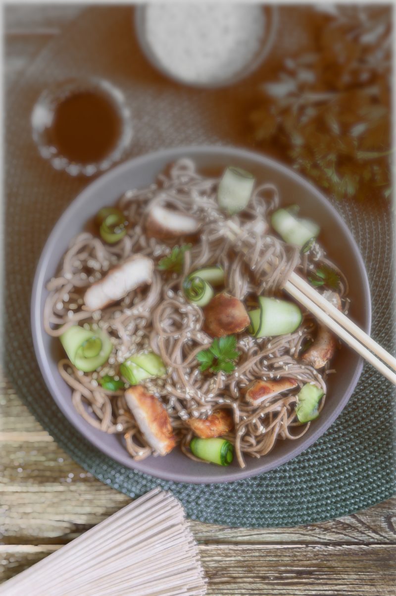 Cold soba with chicken, fresh cucumbers, sauce and sesame. Classic cold salad with buckwheat noodles. Japanese food. Traditional asian cuisine. Top view, flat lay. - https://depositphotos.com/free-files/noodles.html?qview=274519324