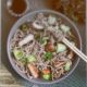Cold soba with chicken, fresh cucumbers, sauce and sesame. Classic cold salad with buckwheat noodles. Japanese food. Traditional asian cuisine. Top view, flat lay. - https://depositphotos.com/free-files/noodles.html?qview=274519324
